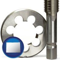 colorado a metal die and a screw tap, isolated on a white background