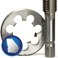 georgia a metal die and a screw tap, isolated on a white background