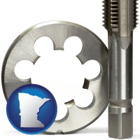 minnesota a metal die and a screw tap, isolated on a white background