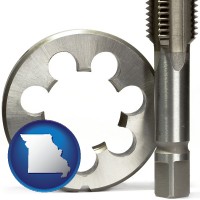 missouri a metal die and a screw tap, isolated on a white background