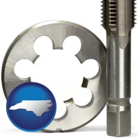 north-carolina map icon and a metal die and a screw tap, isolated on a white background