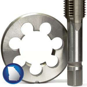 a metal die and a screw tap, isolated on a white background - with Georgia icon