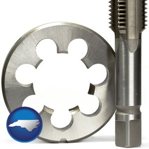 a metal die and a screw tap, isolated on a white background - with North Carolina icon