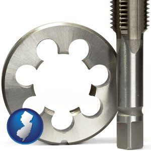 a metal die and a screw tap, isolated on a white background - with New Jersey icon