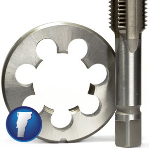 a metal die and a screw tap, isolated on a white background - with Vermont icon